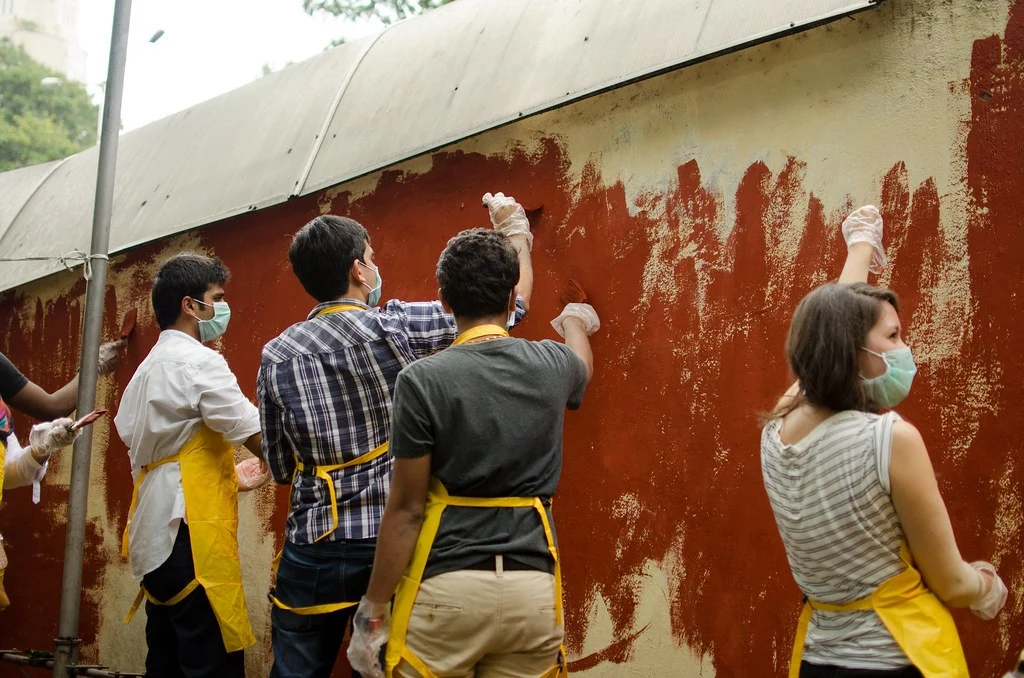 Participants painting a wall together during the 2014 Adventure.