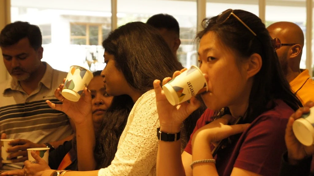 Participants tasting coffee together during the 2023 Adventure.