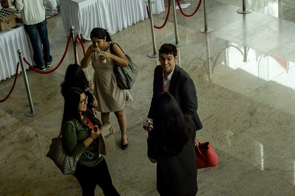 Attendees being photographed on arrival at All or Nothing.