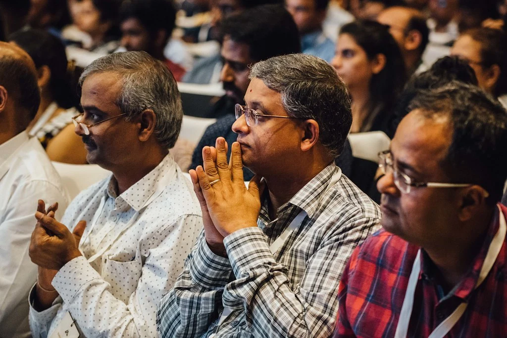 Audience members applauding at Beyond Resilience.