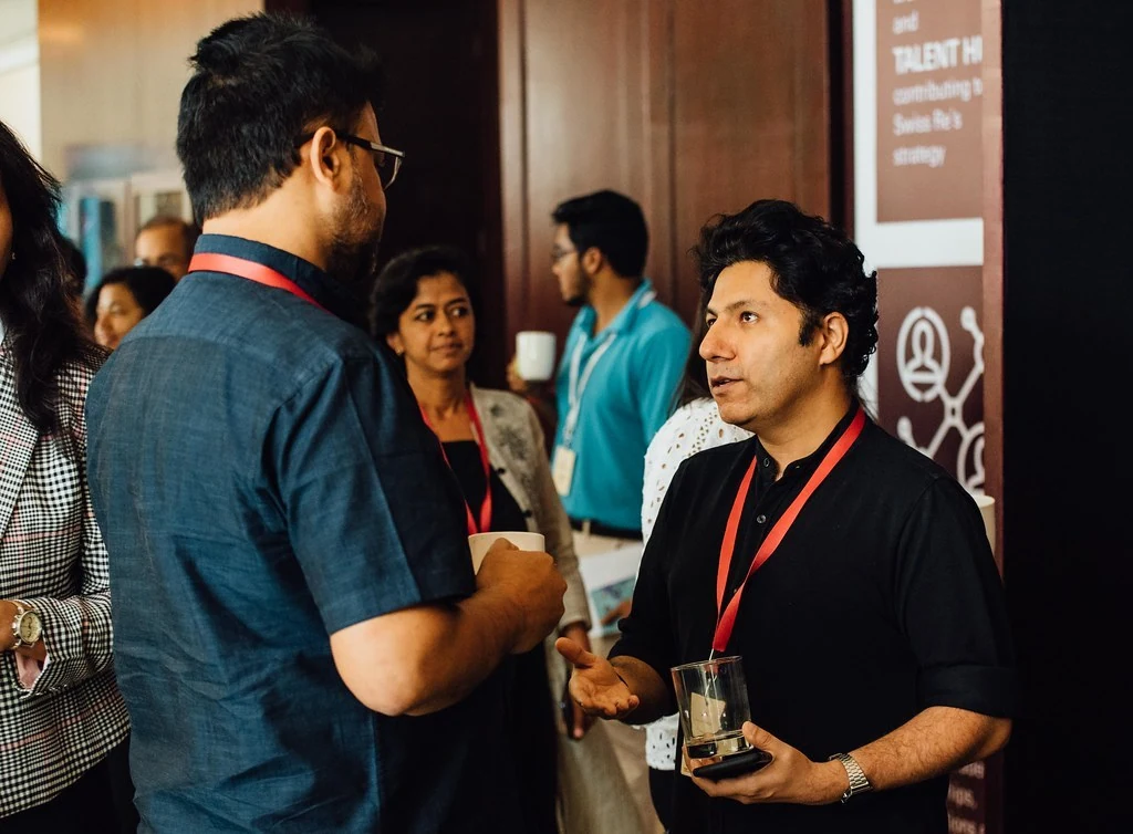 Attendees exchanging ideas between sessions at Beyond Resilience.