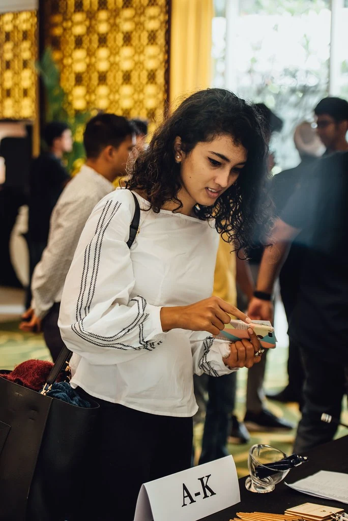 An attendee checking in at registration at Beyond Resilience.
