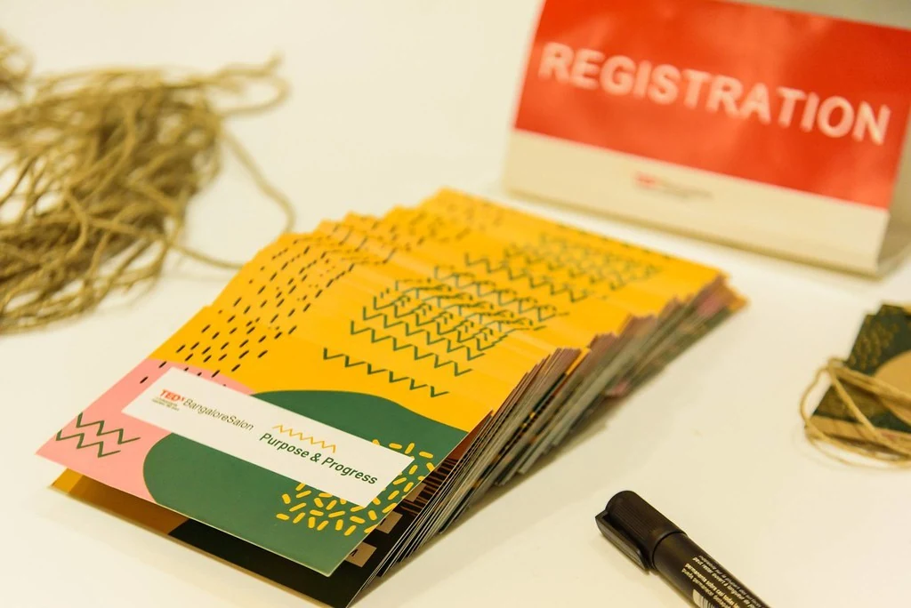 Registration materials and event booklets at Purpose & Progress.