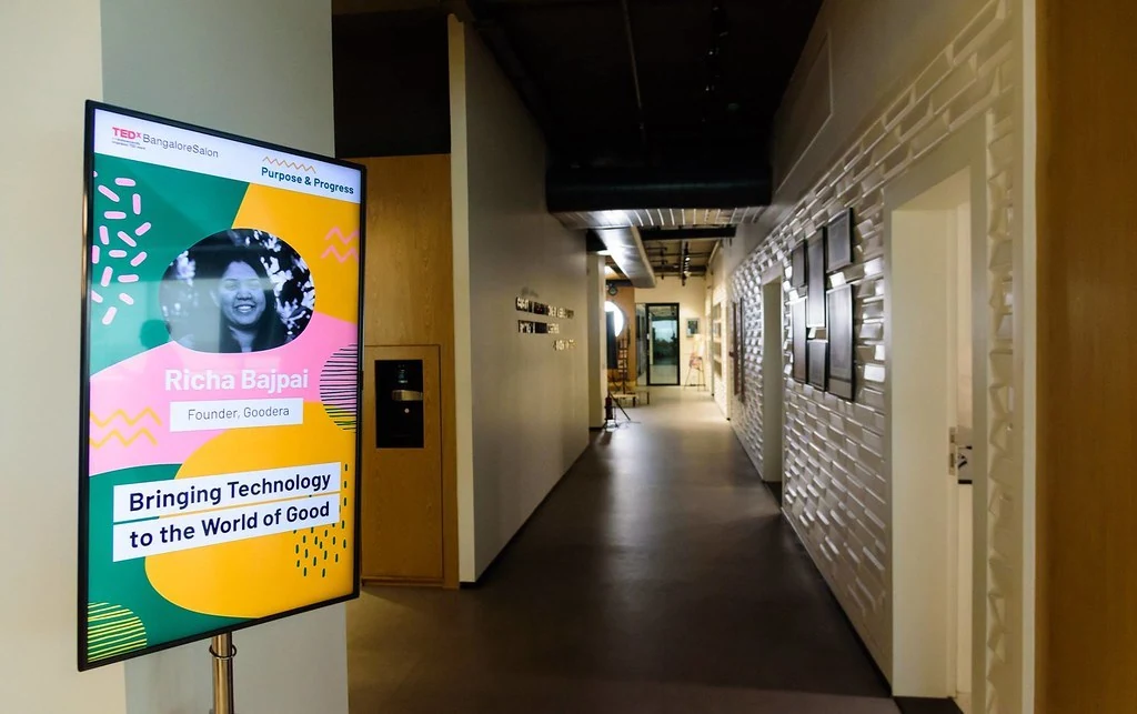 An event display beside a corridor at Purpose & Progress.