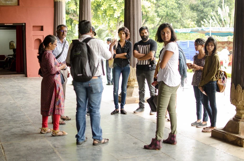 The Unconference group gathering in a shaded colonnade.