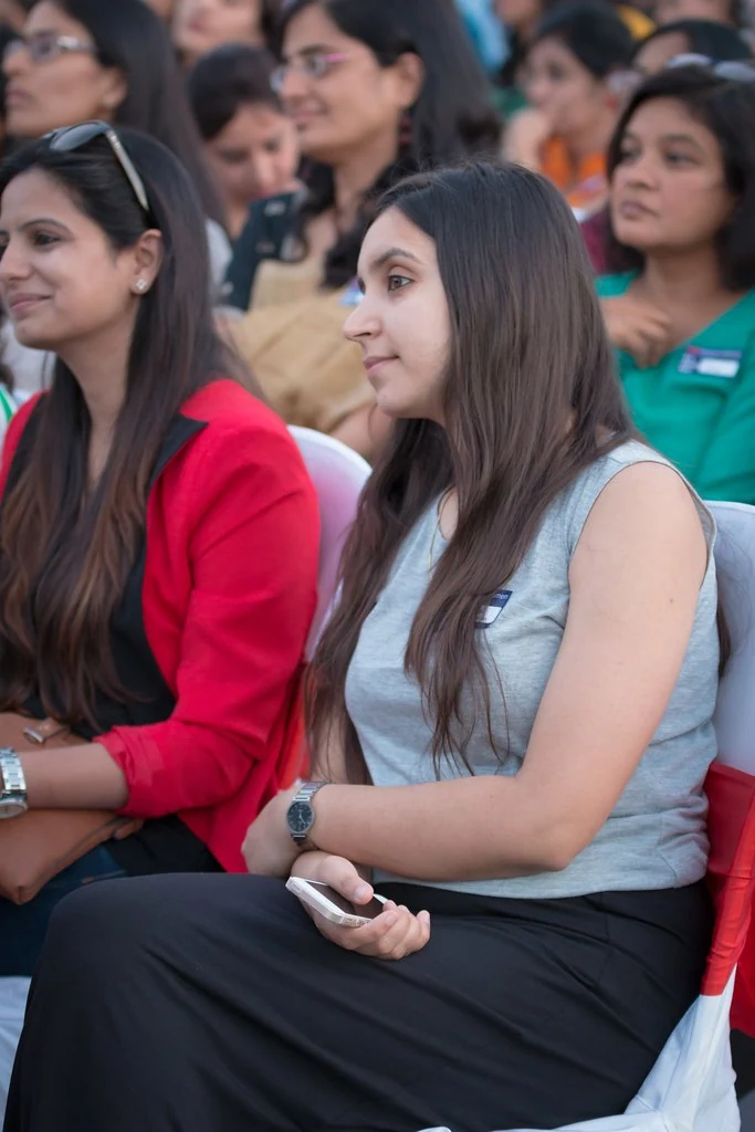 Two audience members following a talk at TEDxBangaloreWomen.