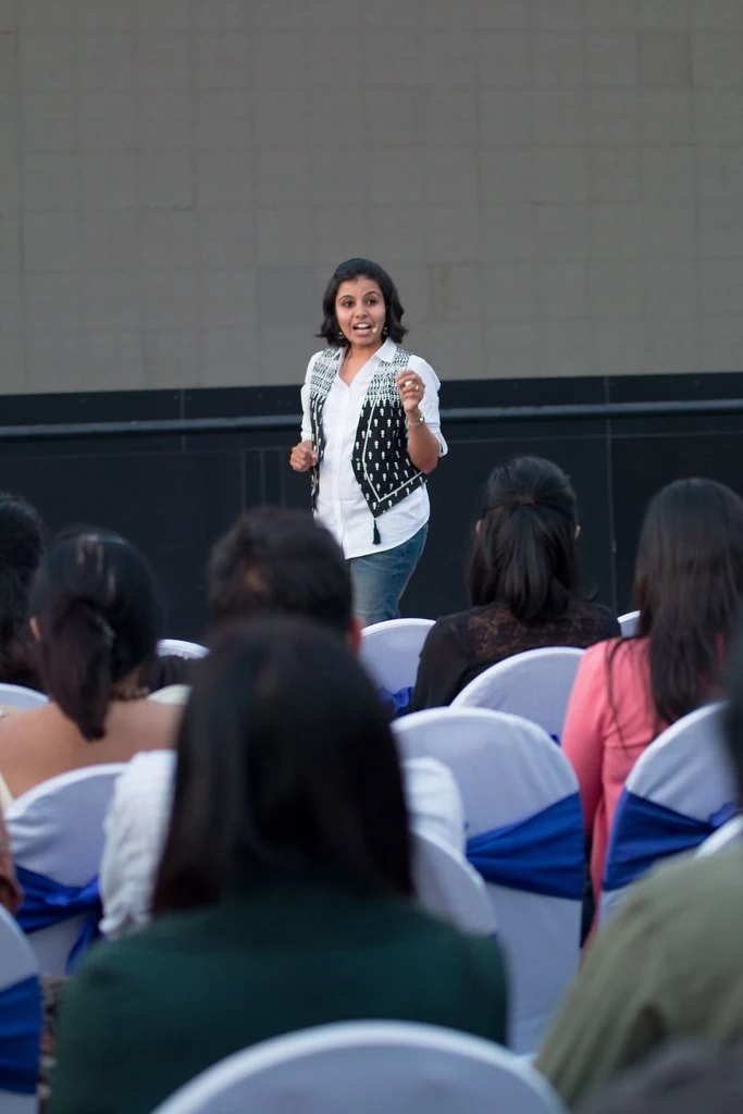 A speaker addressing the outdoor audience at TEDxBangaloreWomen.
