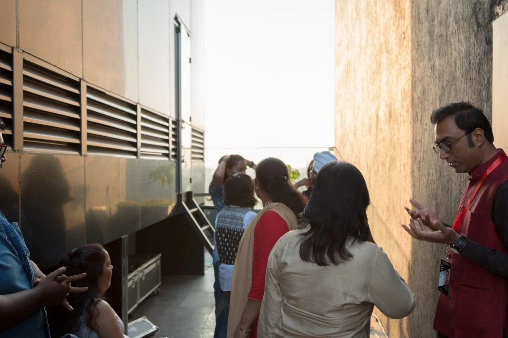 Participants speaking in a corridor at TEDxBangaloreWomen.
